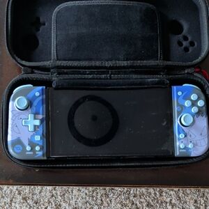 Nintendo Switch OLED with Blue Gengar-Themed Joy-Con Controllers.